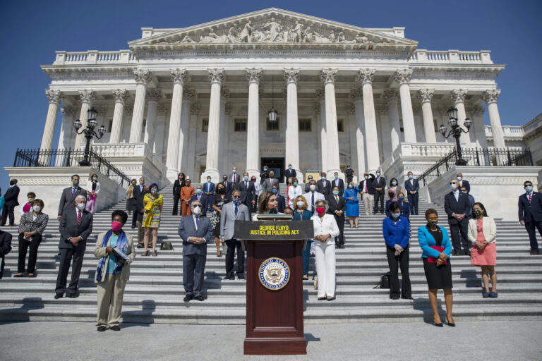 House Speaker Nancy Pelosi of Calif., joined by House Democrats spaced for social distancing, speaks during a news conference on  the House East Front Steps on Capitol Hill in Washington, Thursday, June 25, 2020, ahead of the House vote on the George Floyd Justice in Policing Act of 2020. (AP Photo/Carolyn Kaster)