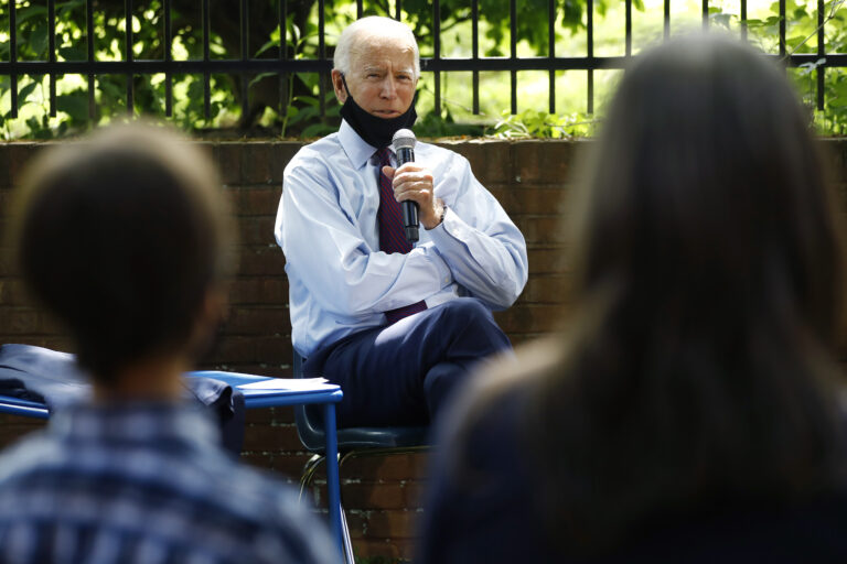 Democratic presidential candidate, former Vice President Joe Biden, center, speaks to Stacie Ritter, right, and her son, Jan, during a meeting with families who have benefited from the Affordable Care Act, Thursday, June 25, 2020, in Lancaster, Pa. (AP Photo/Matt Slocum)