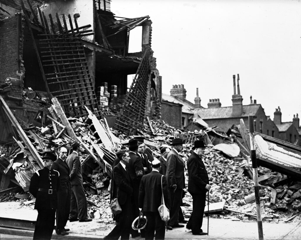 WWII BRITAIN BLITZ Britain's Prime Minister Winston Churchill, right, accompanied by officials, inspects the damage caused by German bombs in London's East End, Sept. 9, 1940, during the Blitz. (AP Photo/British Official Photo)