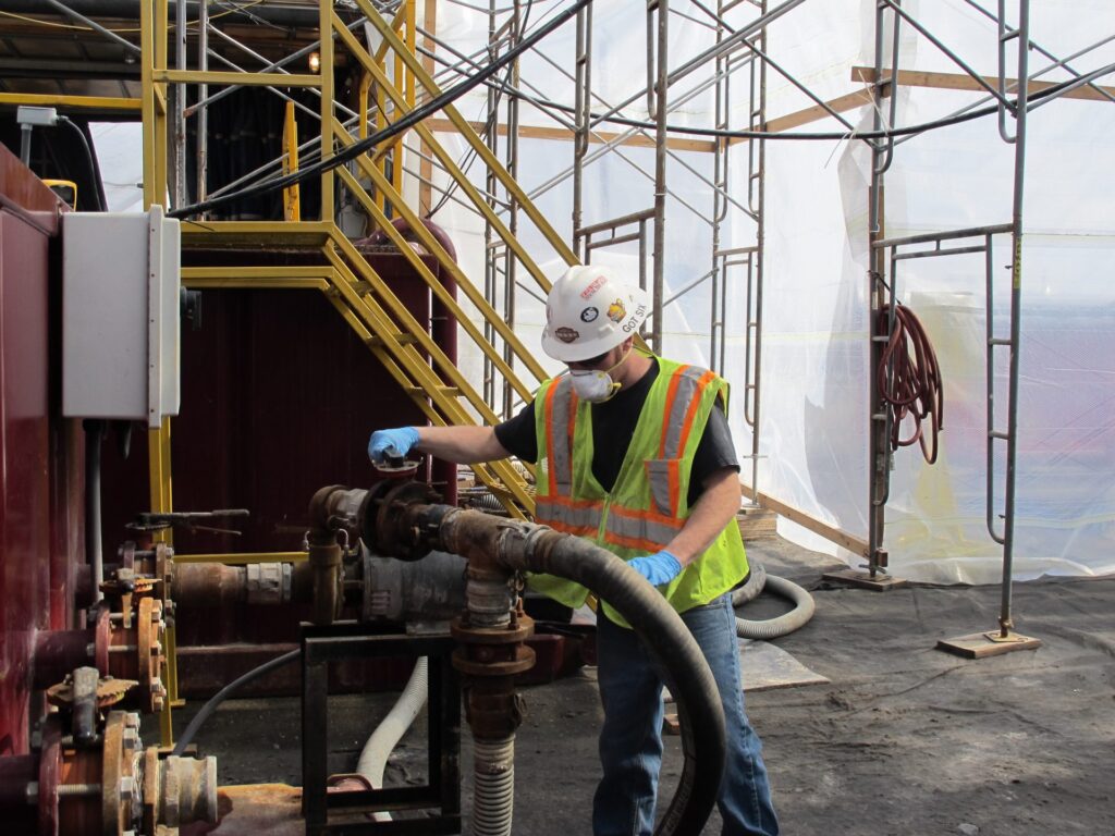 IMG_1020-1920×1440 A worker operates valves at a frack water recycling plant used by Cabot Oil and Gas. (StateImpact Pennsylvania)