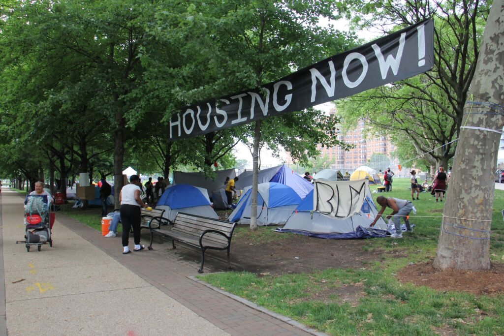 Image from iOS (71) A growing homeless encampment at 22nd Street and the Ben Franklin Parkway is actually a protest against a law that prohibits camping on public property. (Emma Lee/WHYY)