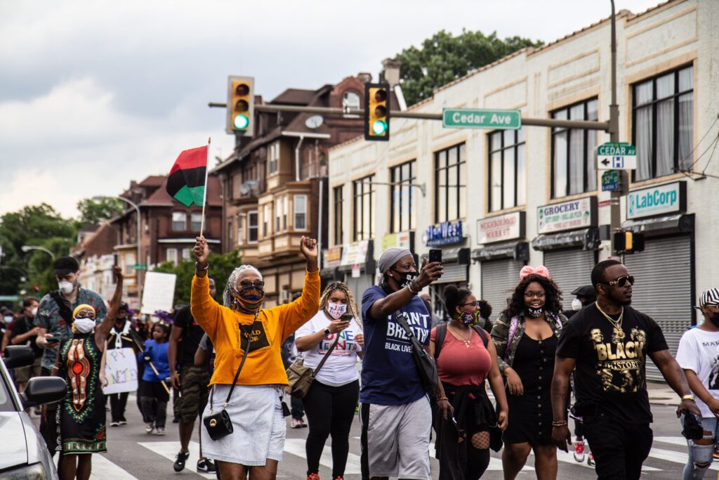 Image from iOS (82) Protesters with the Black Lives Matter march down Pine Street on Juneteenth in West Philly. (Kimberly Paynter/WHYY)