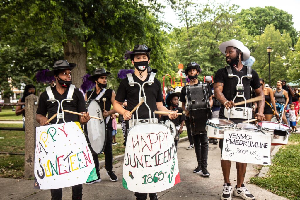 Image from iOS (87) The Positive Movement Entertainment drill team leads a protest