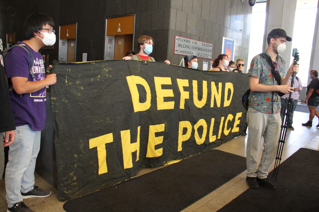 Image from iOS (90) Protesters at the Philadelphia Municipal Services Building demand the resignation of city Managing Director Brian Abernathy. (Emma lee/WHYY)