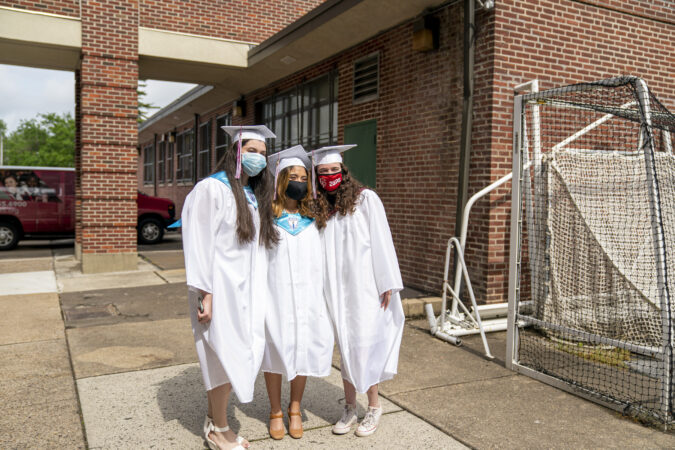 Ashley with friends on graduation day at Little Flower Catholic School for Girls in Hunting Park. (Jessica Kourkounis for Keystone Crossroads)
