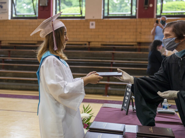 Ashley receives her diploma on graduation day at Little Flower Catholic School for Girls in Hunting Park. (Jessica Kourkounis for Keystone Crossroads)