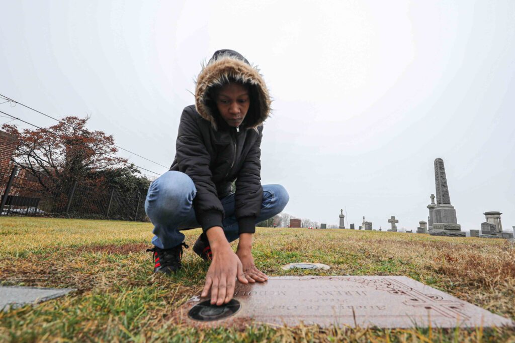 News 2020 – FEB 06 – Keandra McDole, the sister of Jeremy McDole, a wheelchair bound man who was shot to death by police Keandra McDole kneels over the grave of her Jeremy McDole, who was shot to death by police on Tulip Street in 2015. (Saquan Stimpson for WHYY)