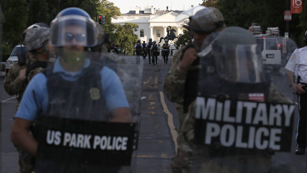 Authorities clear Lafayette Park in Washington, D.C., on Monday, while across the street at the White House, President Trump said he would send the military to U.S. cities if local officials don’t end unrest. Authorities clear Lafayette Park in Washington, D.C., on Monday, while across the street at the White House, President Trump said he would send the military to U.S. cities if local officials don't end unrest. (Alex Brandon/AP Photo)