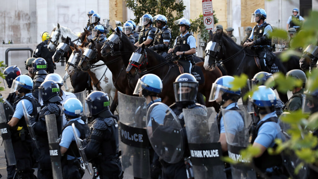 Police gather to remove demonstrators from the area around Lafayette Park and the White House before President Trump’s walk to St. John’s Church. Police gather to remove demonstrators from the area around Lafayette Park and the White House before President Trump's walk to St. John's Church.