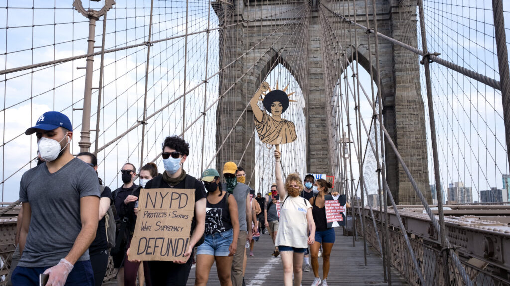 Protesters and activists walk across the Brooklyn Bridge Saturday in New York. Cities saw some of their biggest gatherings of the past two weeks on Saturday. Protesters and activists walk across the Brooklyn Bridge Saturday in New York. Cities saw some of their biggest gatherings of the past two weeks on Saturday.