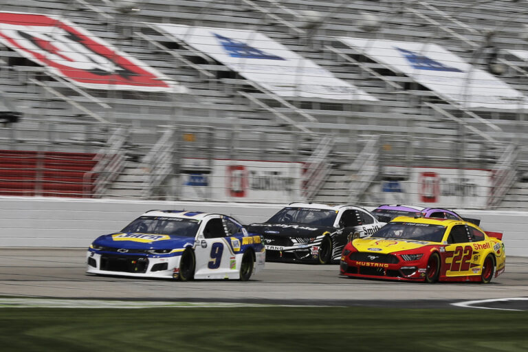 Chase Elliott (9), Aric Almirola (10) and Joey Logano (22) drive during a NASCAR Cup Series auto race at Atlanta Motor Speedway on Sunday in Hampton, Ga. On Wednesday, NASCAR announced a ban of the Confederate battle flag at all of its events and properties. (Brynn Anderson/AP Photo)