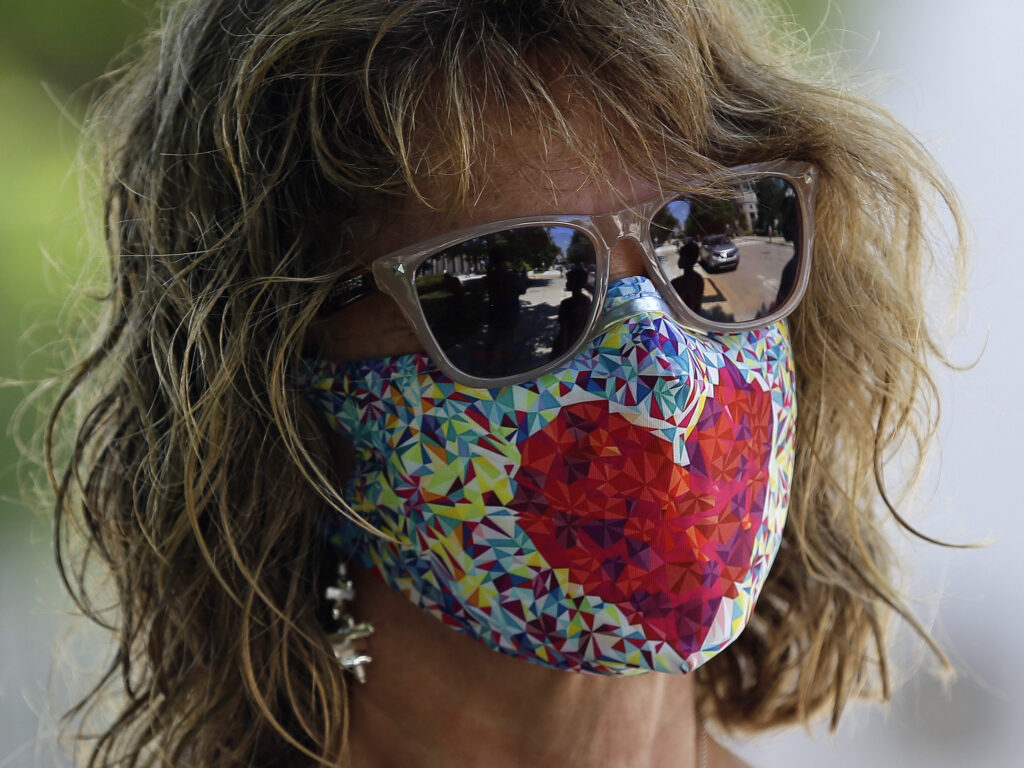 The Department of Justice has issued an alert about a card circulating online falsely claiming that holders are legally exempt from wearing a mask. Public health officials overwhelmingly recommend wearing a mask when going out in public. The Department of Justice has issued an alert about a card circulating online falsely claiming that holders are legally exempt from wearing a mask. Public health officials overwhelmingly recommend wearing a mask when going out in public. (Gerry Broome/AP Photo)