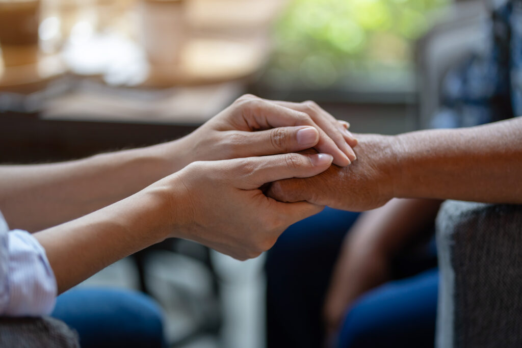 two people holding hands Two people holding hands