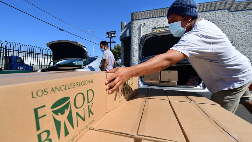 Boxes of food at are loaded at the Los Angeles Regional Food Bank on May 5. The country has officially entered a recession amid the pandemic, the National Bureau of Economic Research said Monday. Boxes of food at are loaded at the Los Angeles Regional Food Bank on May 5. The country has officially entered a recession amid the pandemic, the National Bureau of Economic Research said Monday.