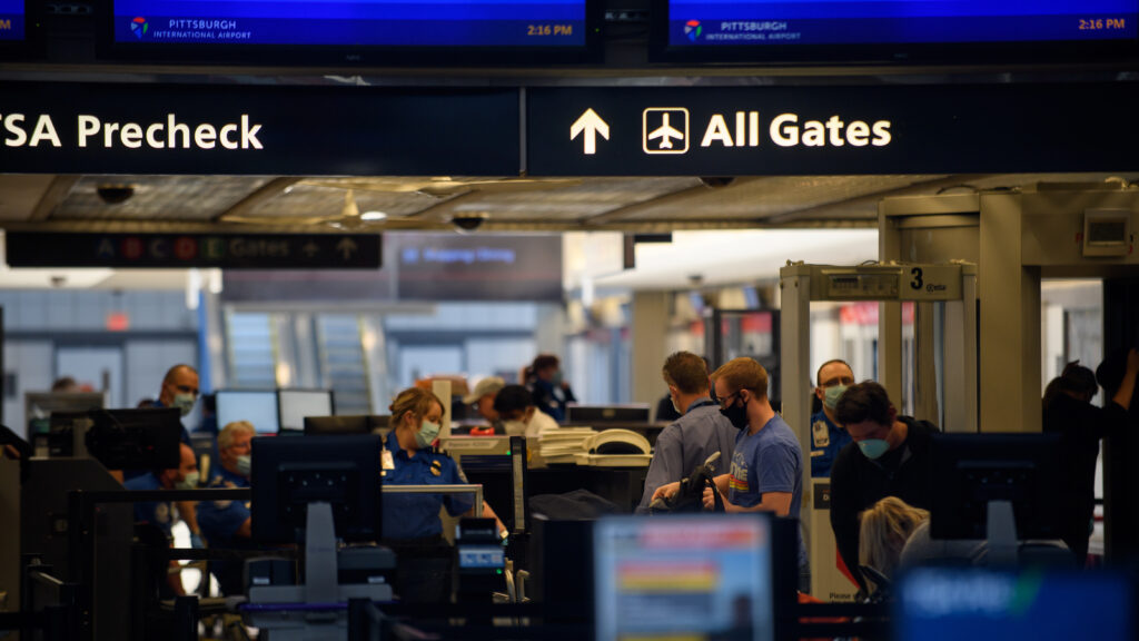 Travelers make their way through ticketing and TSA inspection at the Pittsburgh International Airport on May 7. (Jeff Swensen/Getty Images)