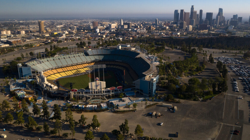 Dodger Stadium in Los Angeles stands empty in an aerial view from late May. Games will resume in late July. Dodger Stadium in Los Angeles stands empty in an aerial view from late May. Games will resume in late July. (Bing Guan/Bloomberg via Getty Images)