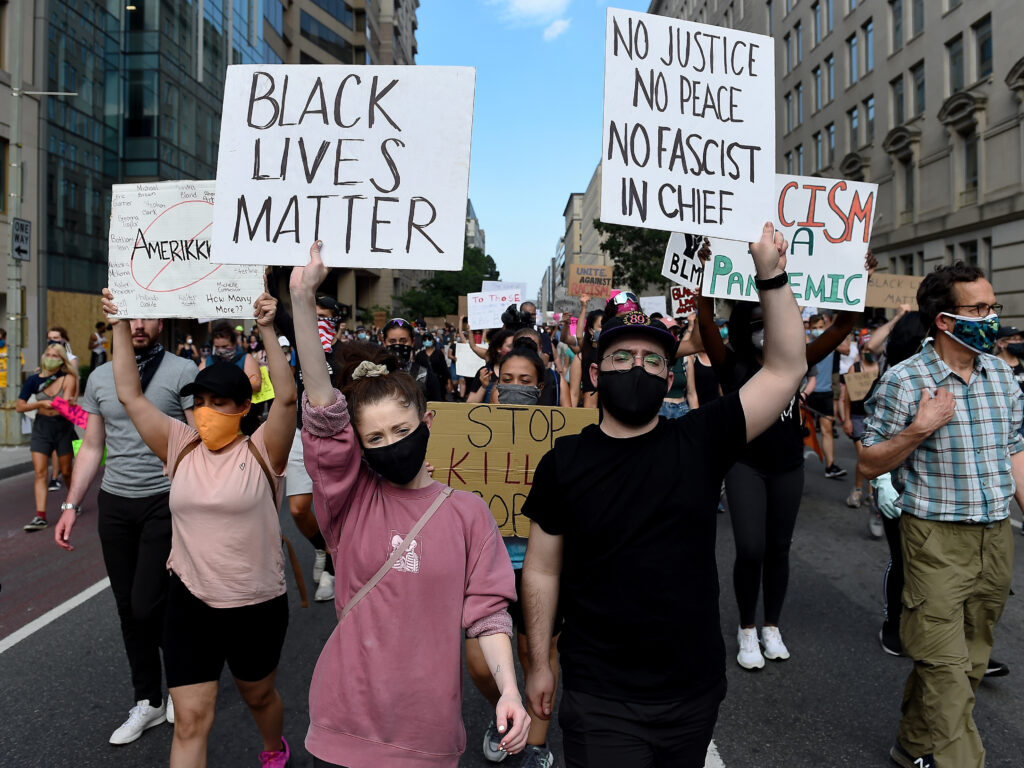 Demonstrators march near the White House on Thursday, protesting the death of George Floyd in Minneapolis police custody. Demonstrators march near the White House on Thursday, protesting the death of George Floyd in Minneapolis police custody. (Olivier Douliery/AFP via Getty Images)