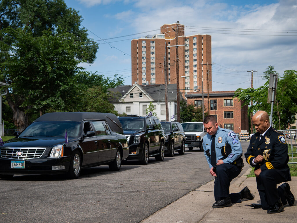 Minneapolis Police Chief Medaria Arradondo (right) kneels as the hearse of George Floyd arrives to North Central University ahead of funeral service on Thursday. Protests in the wake of Floyd’s death while in police custody has erupted across the country. Minneapolis Police Chief Medaria Arradondo (right) kneels as the hearse of George Floyd arrives to North Central University ahead of funeral service on Thursday. Protests in the wake of Floyd's death while in police custody has erupted across the country.
(The Washington Post/The Washington Post via Getty Images)