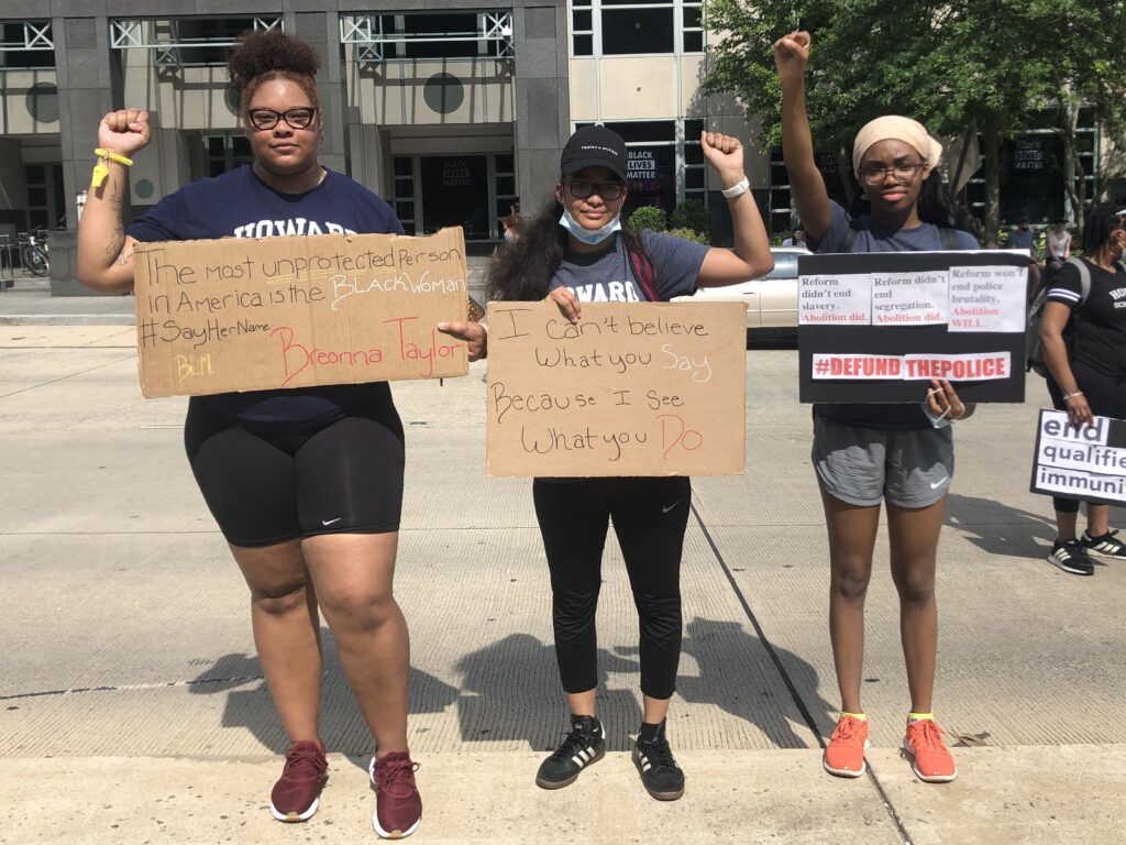 Howard University law students, from left, Chanel Sherrod, Domonique Dille and Temitope Aladetimi brought handmade signs to a protest near the White House last Saturday. Howard University law students, from left, Chanel Sherrod, Domonique Dille and Temitope Aladetimi brought handmade signs to a protest near the White House last Saturday.