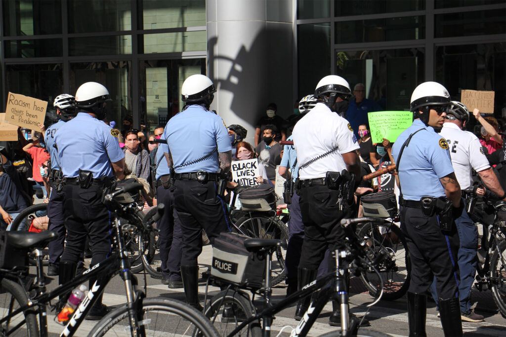 police-floydprotests-emmalee-bikes Protesters at the Pennsylvania Convention Center urge police to ‘take a knee in solidarity' on Monday, June 1, 2020. (Emma Lee/WHYY)