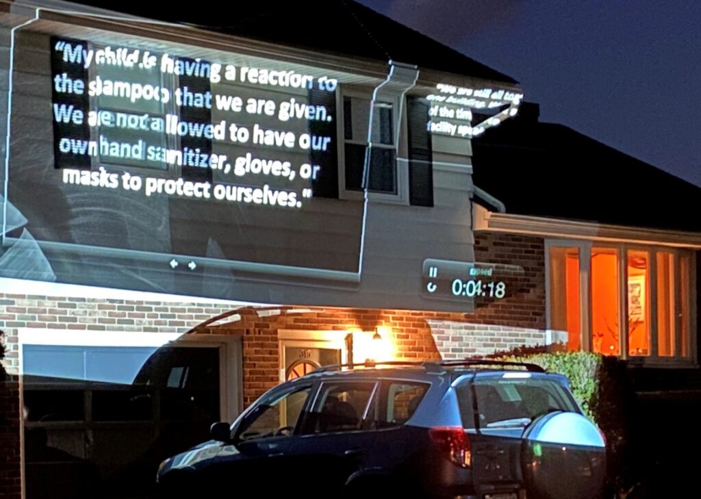 rivera-protest-062920-1920×1366 Protesters calling for the release of families held at the Berks Detention Center used a projector to illuminate the outside of Berks County Commissioner Michael Rivera’s home on Monday, June 29, 2020. (Anthony Orozco / PA Post)