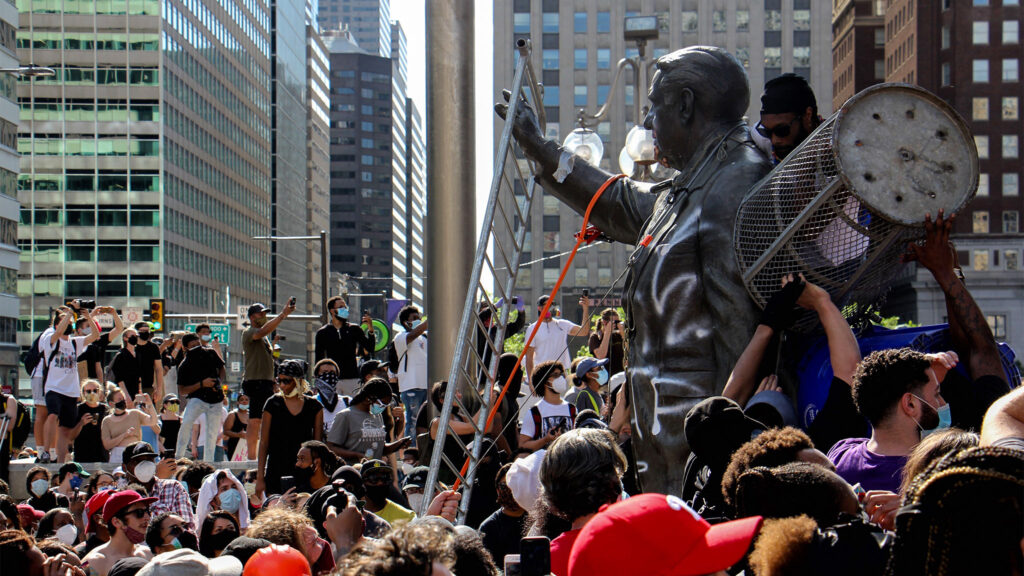 rizzoprotest-01-crop Protesters attacked the Frank Rizzo statue in front of MSB on Saturday. (Emma Lee / WHYY)
