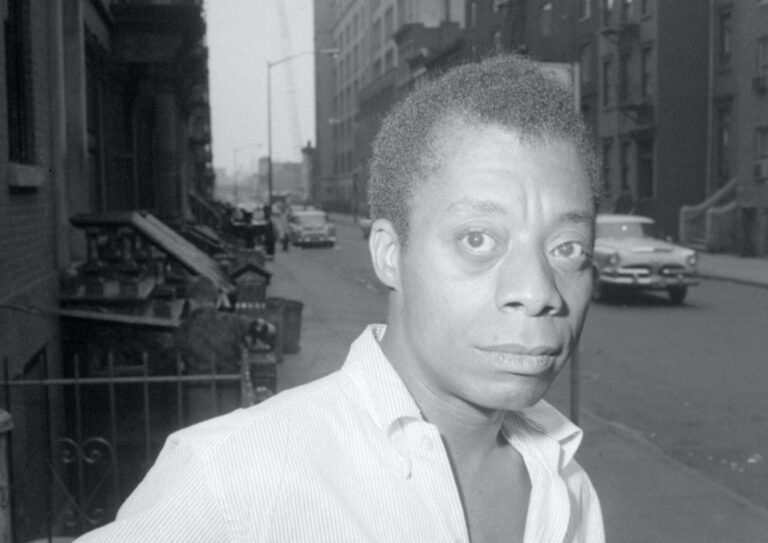 Author James Baldwin is shown on a Harlem street in New York City, June 3, 1963.  (AP Photo/stf)