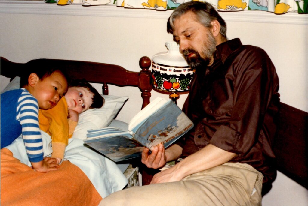2020 07 20-provided-hugh frick reading Hugh Frick reads to his children, Tim and Tegan, in a photo taken circa 1980. (Courtesy of Tim Frick)