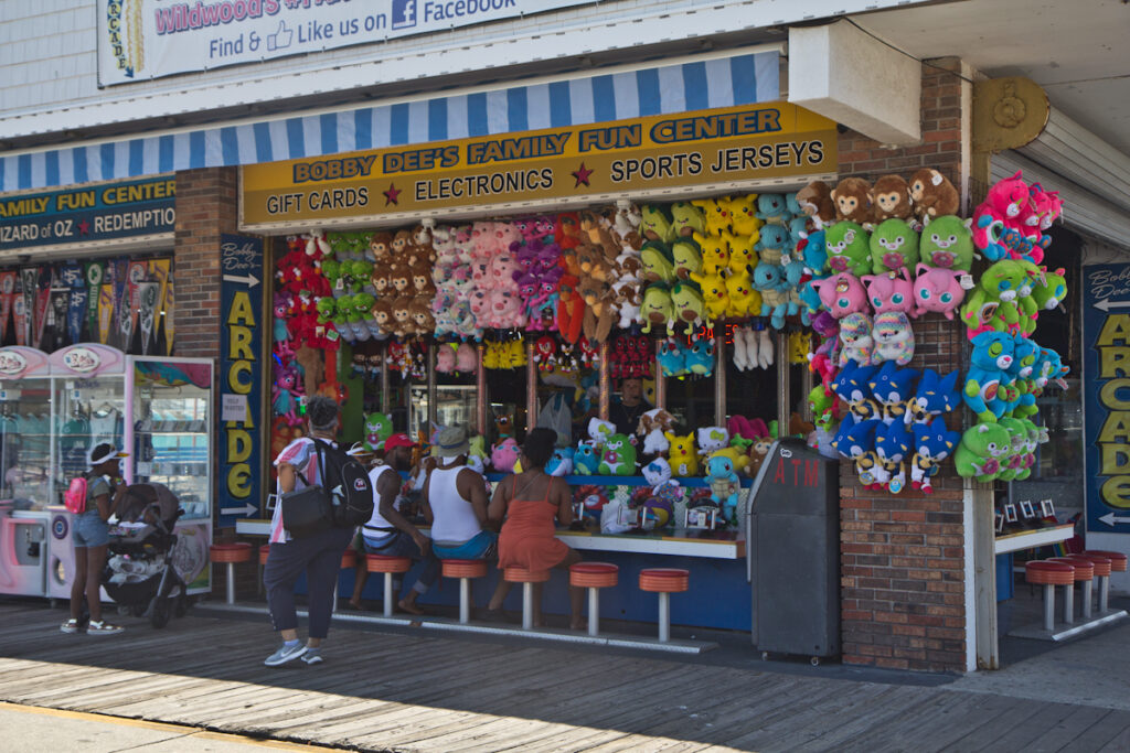 2020 6 30 k paynter wildwood end of june 2020-3 Wildwood People line up to play a water pistol game on the boardwalk in Wildwood, N.J.