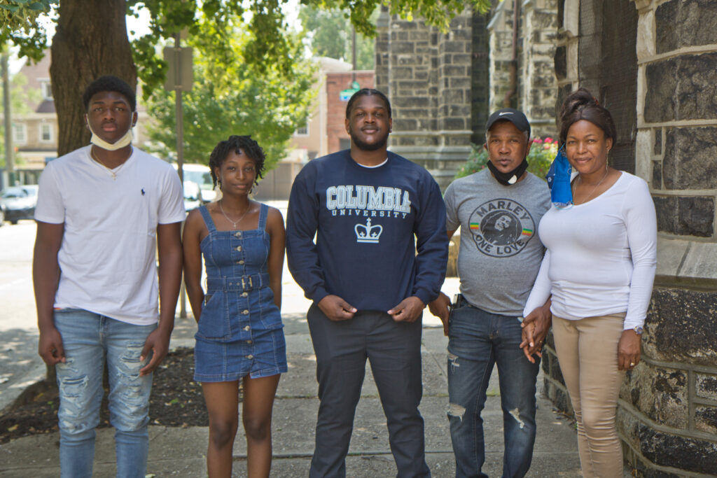 2020 7 22 k paynter scj thompson columbia CJ Thompson (center) with his parents Oneita and Clive Thompson-Lewis (right), and his siblings, Christine, 17, and Timothy, 14. (Kimberly Paynter/WHYY)