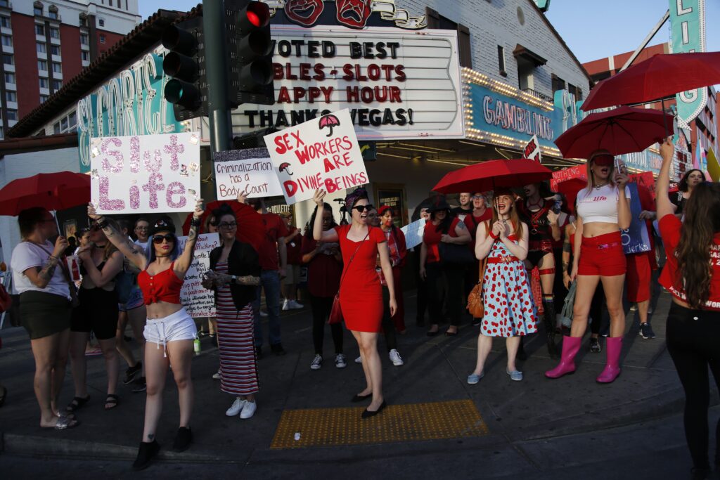 AP_19154107900803main People chant as they march in support of sex workers, Sunday, June 2, 2019, in Las Vegas. People marched in support of decriminalizing sex work and against the Fight Online Sex Trafficking Act and the Stop Enabling Sex Traffickers Act, among other issues. (AP Photo/John Locher)