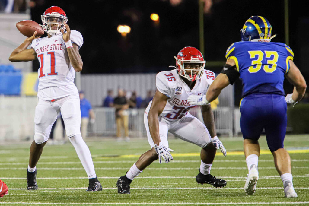 NCAA FOOTBALL 2019 – AUG 29 – Delaware defeated Delaware State 31-13 August 30, 2019, Newark, Delaware, U.S: Delaware State quarterback SHAYNE SMITH (11) attempts a pass to the end zone during a week one game between the Delaware Blue Hens and Delaware State Thursday, AUG. 29, 2019, at Tubby Raymond Field at Delaware Stadium in Newark, DE. (Credit Image: © Saquan Stimpson/ZUMA Wire) (Cal Sport Media via AP Images)