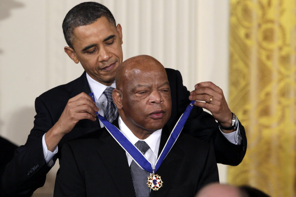 Barack Obama, John Lewis FILE - In this Feb. 15, 2011, file photo, President Barack Obama presents a 2010 Presidential Medal of Freedom to U.S. Rep. John Lewis, D-Ga., during a ceremony in the East Room of the White House in Washington. Lewis, who carried the struggle against racial discrimination from Southern battlegrounds of the 1960s to the halls of Congress, died Friday, July 17, 2020. (AP Photo/Carolyn Kaster, File)
