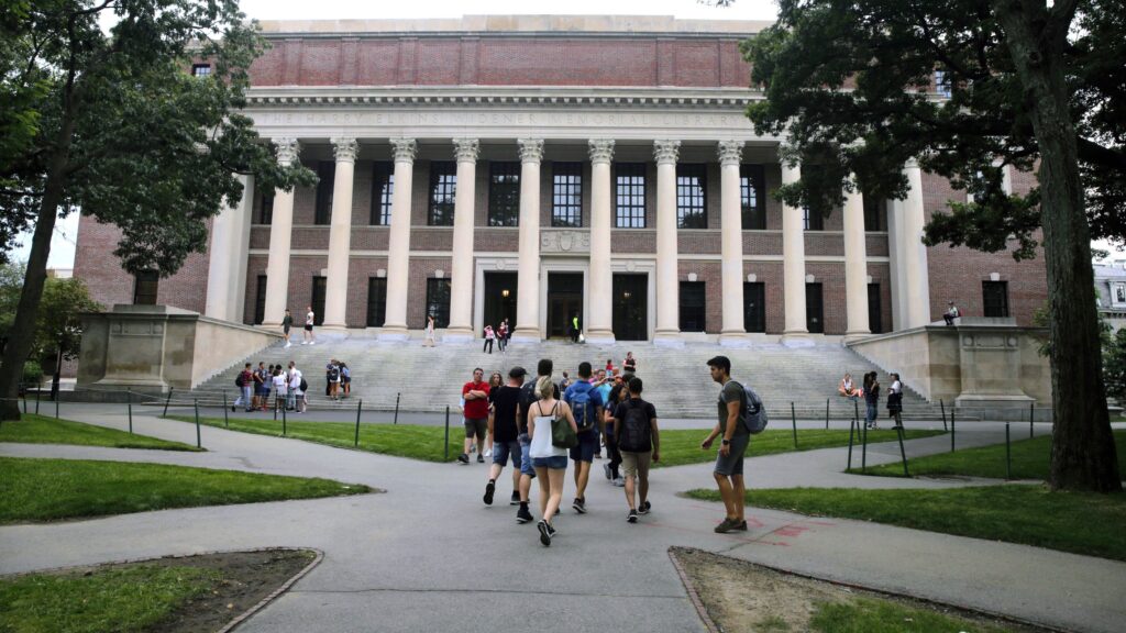 Virus Outbreak-Harvard Plans In this Aug. 13, 2019 file photo, students walk near the Widener Library in Harvard Yard at Harvard University in Cambridge, Mass. The Ivy League school announced Monday, July 6, 2020, that as the coronavirus pandemic continues its freshman class will be invited to live on campus this fall, while most other undergraduates will be required learn remotely from home. (AP Photo/Charles Krupa, File)