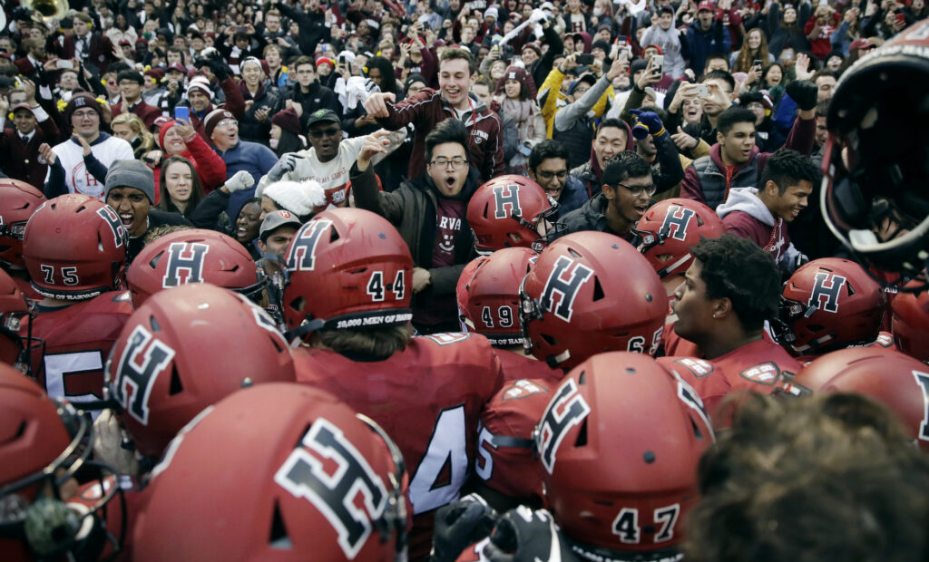 Joey Goodman Harvard players, students and fans celebrate a win over Yale after an NCAA college football game at Fenway Park in Boston, Saturday, Nov. 17, 2018. Harvard defeated Yale 45-27. (AP Photo/Charles Krupa)