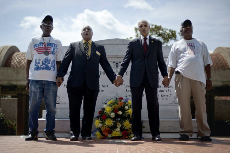 In this Wednesday, April 4, 2012 file photo, civil rights activists and Southern Christian Leadership Conference members from left, Ralph Worrell, Dr. Bernard Lafayette, Jr., C.T. Vivian and Frederick Moore, join hands and sing 