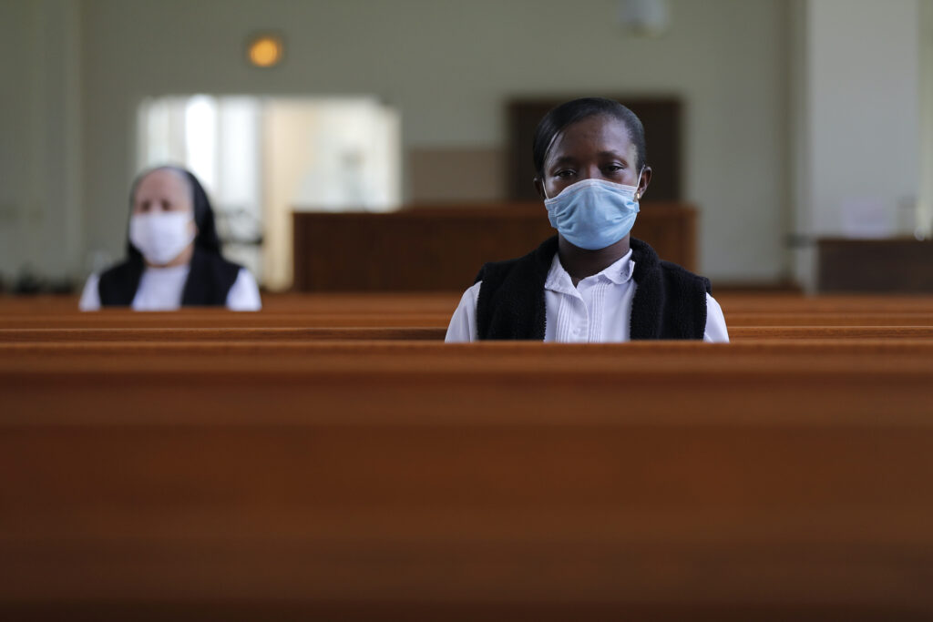 Black Catholic History Faustina Bema, a candidate for Novice of the Sisters of the Holy Family, prays inside a chapel during a retreat at their Mother House in New Orleans, Thursday, July 23, 2020. (AP Photo/Gerald Herbert)