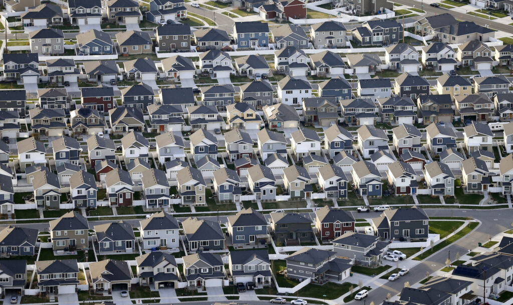Election 2020 Trump Suburbs This April 13, 2019, file photo, shows rows of homes, in suburban Salt Lake City. (AP Photo/Rick Bowmer)