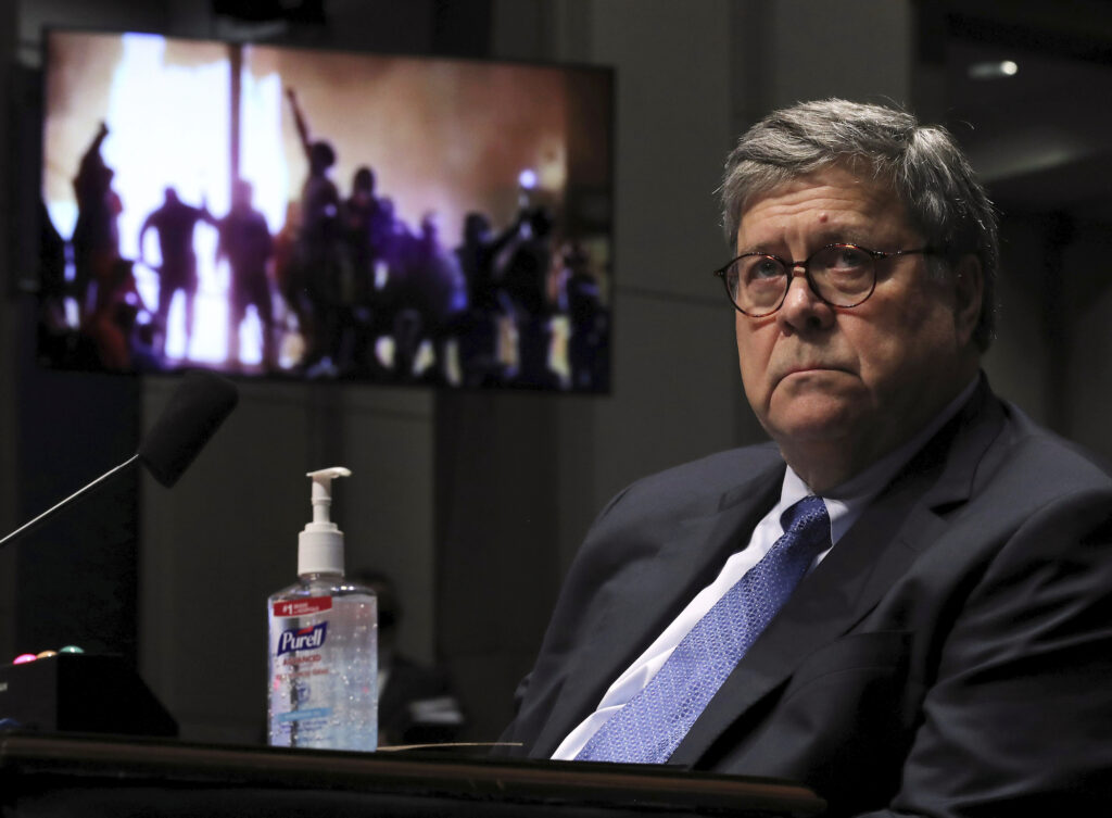 Congress Attorney General U.S. Attorney General William Barr watches a Republican Exhibit video of people rioting, during a the House Judiciary Committee hearing July 28, 2020 in Washington, DC. In his first congressional testimony in more than a year, Barr is expected to face questions from the committee about his deployment of federal law enforcement agents to Portland, Oregon, and other cities in response to Black Lives Matter protests; his role in using federal agents to violently clear protesters from Lafayette Square near the White House last month before a photo opportunity for President Donald Trump in front of a church; his intervention in court cases involving Trump's allies Roger Stone and Michael Flynn; and other issues. (Photo by Chip Somodevilla/Getty Images)