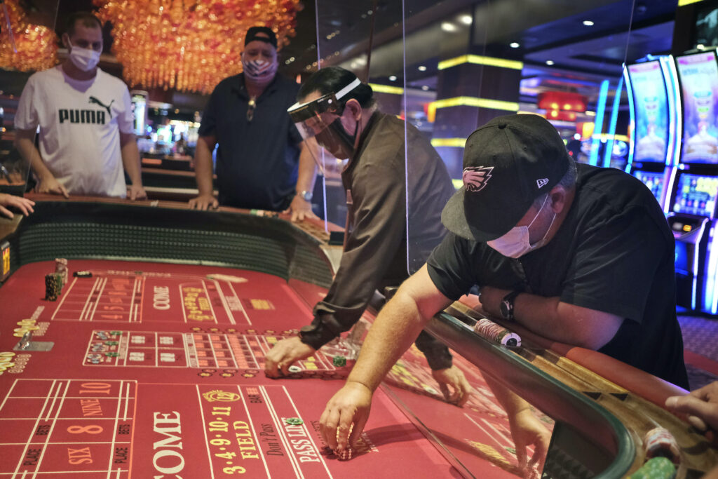 Craps players and dealers are seperated by partitions at the Golden Nugget Casino