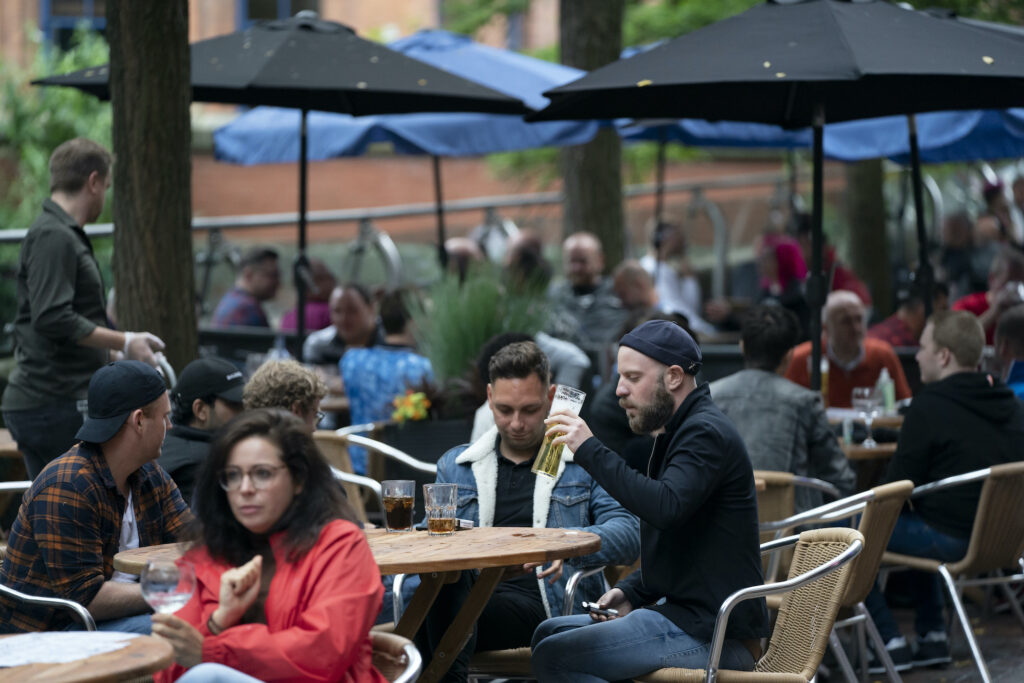 Virus Outbreak Britain Members of the public are seen at a bar on Canal Street