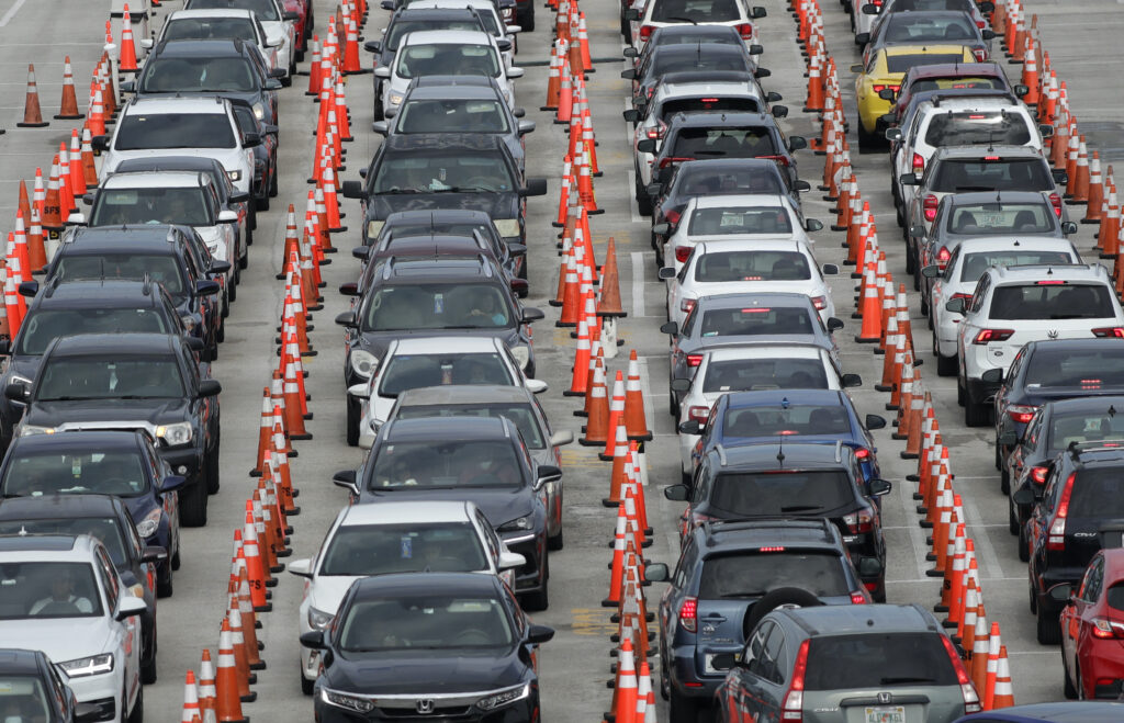 AP_coronavirus_testing_070820 Lines of cars wait at a drive-through coronavirus testing site