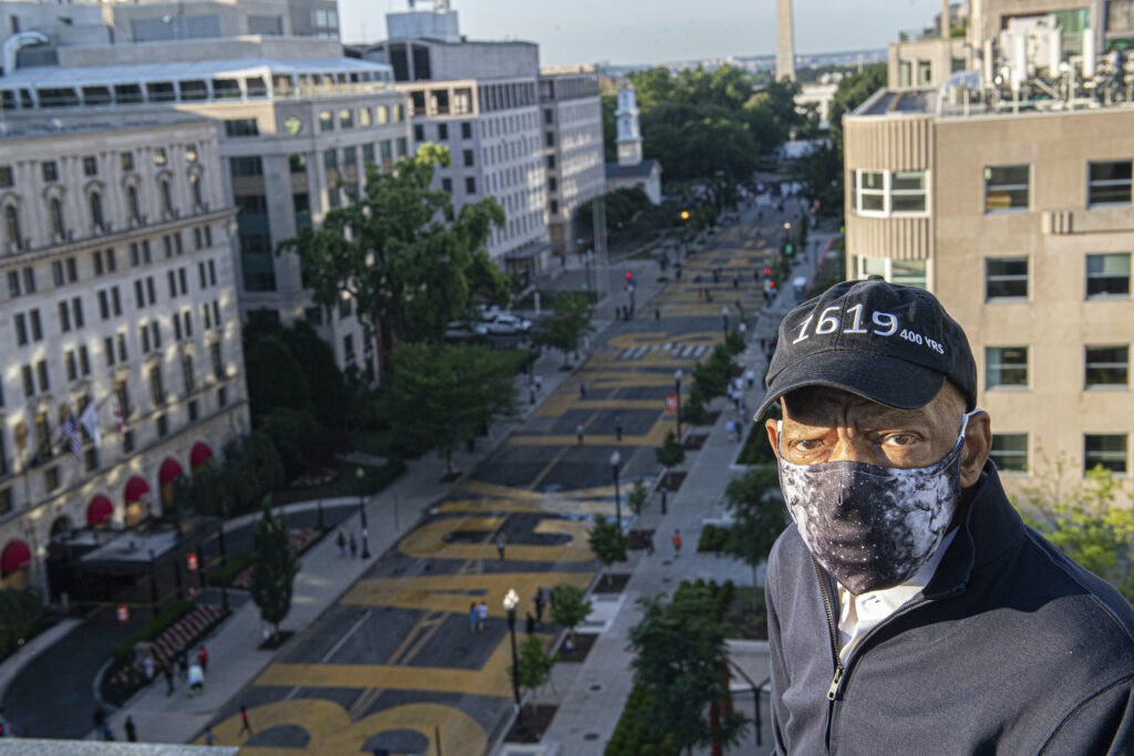 AP_john_lewis_BLM_071920 John Lewis looks over a section of 16th Street that's been renamed Black Lives Matter Plaza