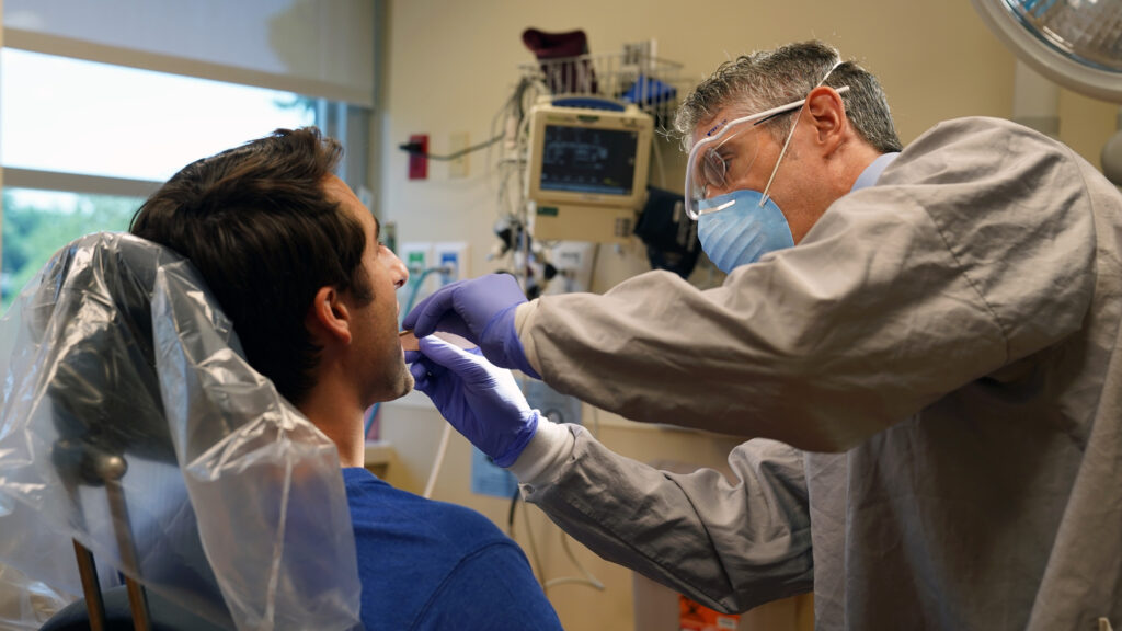 Dr-Meara-and-Patient.jpg Dr. Dan Meara examines a patient. (Provided by Christiana Care)
