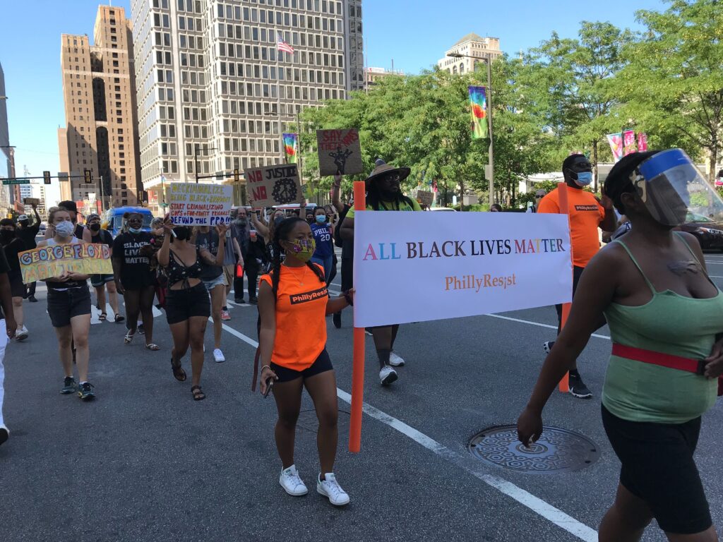 Image from iOS (122) PhillyResist protesters marched through the streets on Monday. (Avi Wolfman-Arent / WHYY)