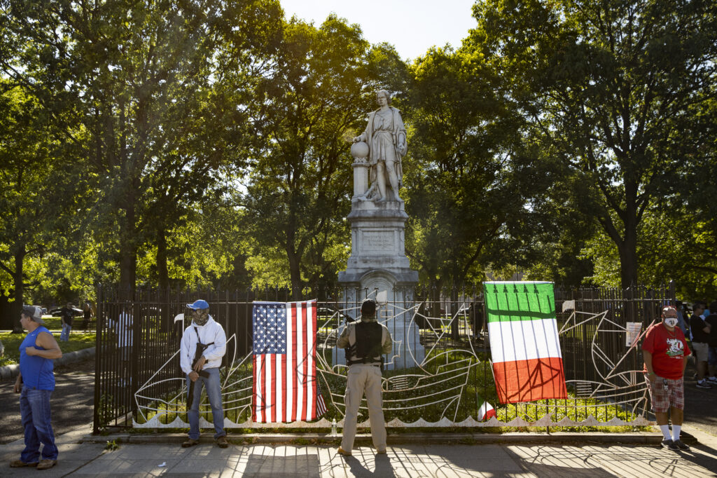 6/13/2020 A group of armed people guard a statue of Christopher Columbus located in Marconi Park on South Broad St. These men said they believed that Black Lives Matter/ANTIFA protestors were on their way to destroy the statue. (Courtesy of Ryan Collerd)