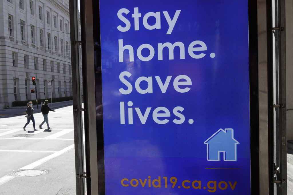 In San Francisco, a poster seen in March urges the public to socially distance in an effort to contain the spread of the coronavirus. In San Francisco, a poster seen in March urges the public to socially distance in an effort to contain the spread of the coronavirus.