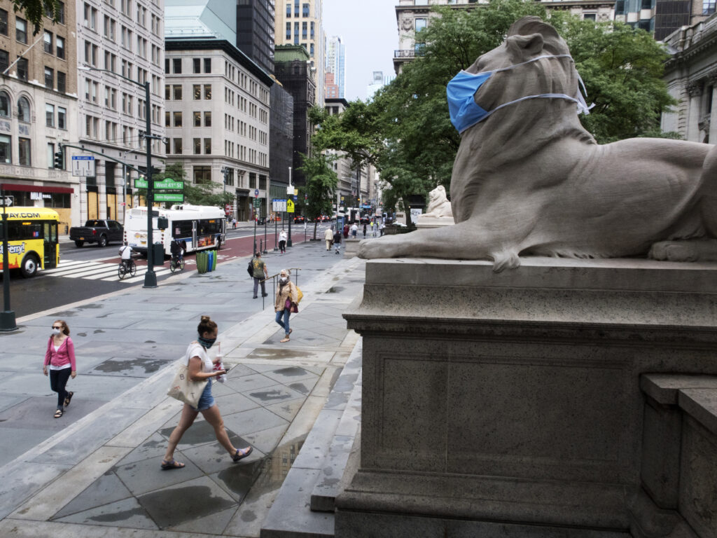 A face mask covers the mouth and nose of one of the iconic lion statues in front of the New York Public Library Main Branch on Wednesday, July 1, 2020, in New York, amid the coronavirus pandemic. A face mask covers the mouth and nose of one of the iconic lion statues in front of the New York Public Library Main Branch on Wednesday, July 1, 2020, in New York, amid the coronavirus pandemic. (Ted Shaffrey/AP)