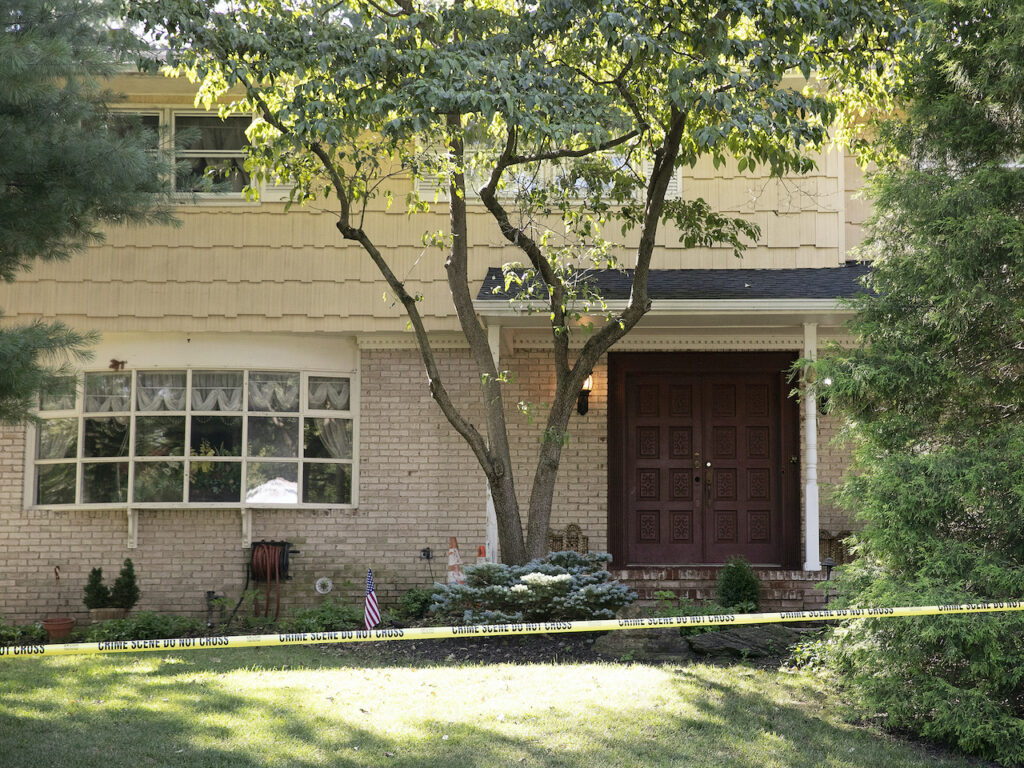 Crime scene tape surrounds the home of U.S. District Judge Esther Salas, Monday, in North Brunswick, N.J. A gunman posing as a delivery person shot and killed Salas’ 20-year-old son and wounded her husband Sunday evening at their New Jersey home before fleeing, according to judiciary officials. Crime scene tape surrounds the home of U.S. District Judge Esther Salas
