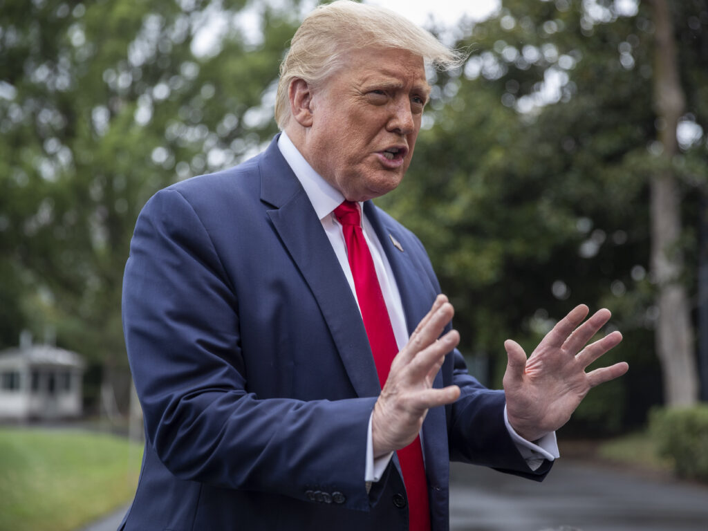 President Donald Trump chats with reporters Friday as he heads to Marine One on the South Lawn of the White House. The day before, he floated the idea of delaying the election, prompting criticism from the Federalist Society’s co-founder. President Donald Trump